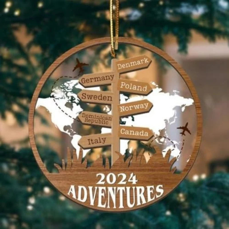 Personalised travel ornament with destination signpost hanging on a Christmas tree